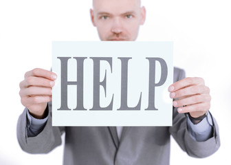 confident businessman holding a banner with the word HELP