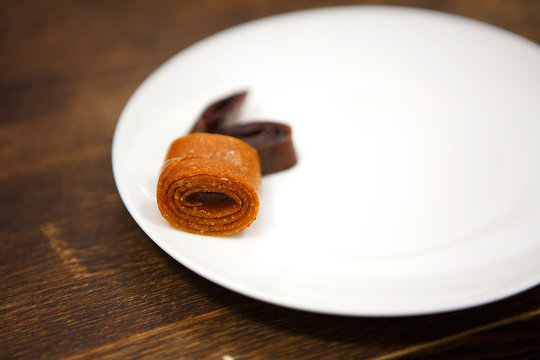 sea ​​buckthorn marshmallowon a white plate. Dessert without sugar. Healthy food