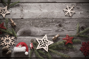 Christmas decoration with fir branch  on old wooden background