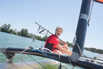 Crédence de cuisine en verre imprimé Naviguer enjoying extreme sailing with racing sailboat
