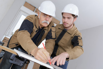 young apprentice and senior mason
