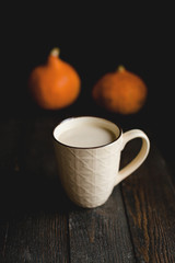 Pumpkin latte, autumn, dark wooden background