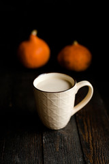 Pumpkin latte, autumn, dark wooden background