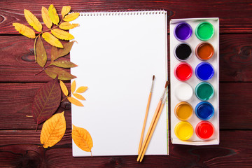Naklejka na ściany i meble Set of artist accessories collection with autumn leaves. Canvas for painting, art brushes, palette.