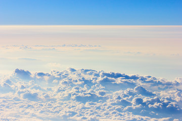 Fototapeta na wymiar Background blue sky with a cloud behind the airplane window