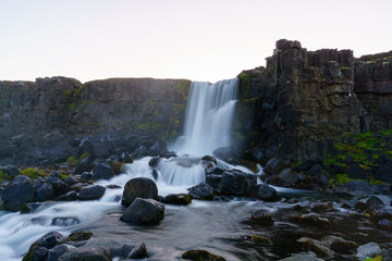 Amazing view of Oxararfoss waterfall in Thingvellir National Park. Scenic image of beautiful nature landscape. Popular tourist attraction. Iceland, Europe. Beauty of earth. Long exposure water.
