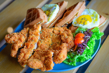 Chicken cutlet Waffle with Sunny Side Up Egg and salad