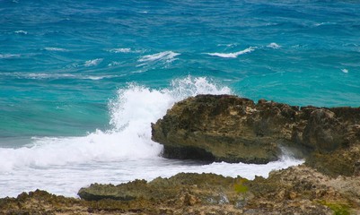 Waves crashing into rock