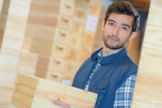 warehouse worker holding boxes