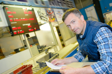purchasing agent checking his list