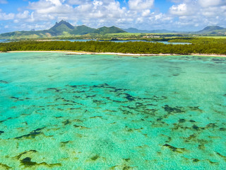 Aerial view of the spectacular blue sea of the famous Deer Island, east coast of Mauritius, Indian Ocean.