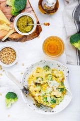 homemade pumpkin pasta tagliatelle with broccoli and pesto