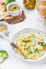 homemade pumpkin paste tagliatelle with broccoli and pesto