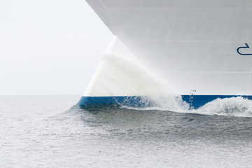 Water splashing on a blue and white bulb