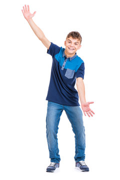Full length portrait of young caucasian teen boy isolated on white background. Funny teenager showing something by hands. Handsome child looking at camera and smiling.