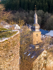 November elevated view to Burg-Reuland, Belgium with the tower of the Church of St. Stephen from the ruins of the fortified Reuland Castle