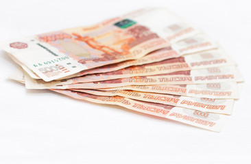 Scattered Russian 5000 rubles banknotes closeup