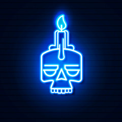 Obraz premium Neon skull with candle on brick wall