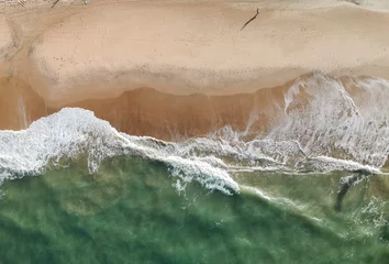 Schilderijen op glas Aerial drone view of a beach, people walking © phaelshoots