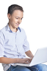 Studio portrait of teenage boy on white background