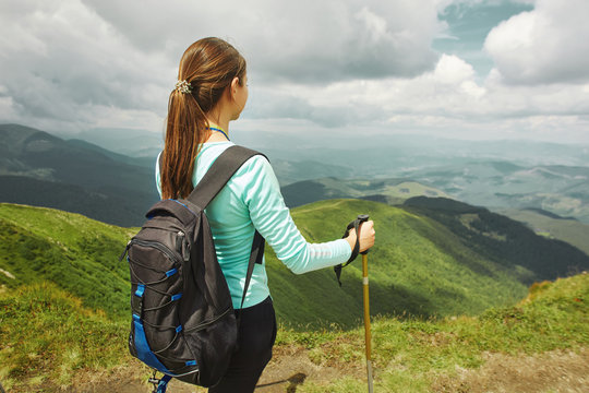 woman hiker enjoying the view of mountains landscape. Carpathians, Ukraine