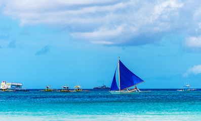 BORACAY, PHILIPPINES - FEBRUARY 28, 2018: View of the sailboat on the background of the sea...