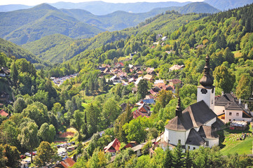 Beautiful church in green hills of Spania dolina - obrazy, fototapety, plakaty