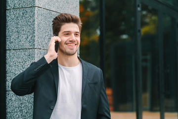 Close up portrait of businessman have conversation using mobile phone. Business guy in formal suit gladly talks with colleague. Office employee, wage worker, weekdays concept