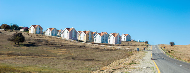 Row of newly built houses in suburban village view