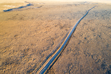 Fototapeta na wymiar Dirt road winding through prairie in northern Colorado