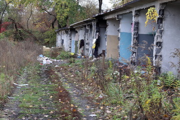 Fototapeta na wymiar Abandoned garages, dirty, trash