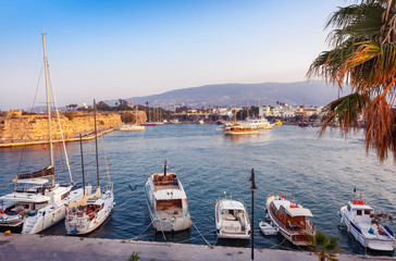 The capital of the island of Kos, Greece, view of the city and marina at sunset, a popular...