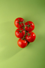 Red tomatoes on green
