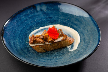 Toast with mushrooms and sauce