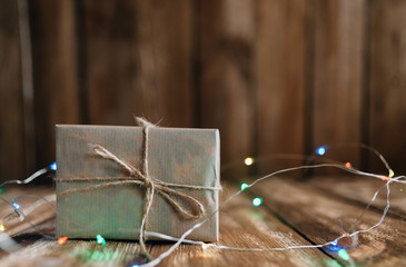New Year's gift with colored lights for a festive atmosphere