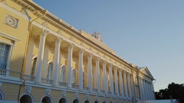 Russian Museum colomn view on a main building with sun setting down