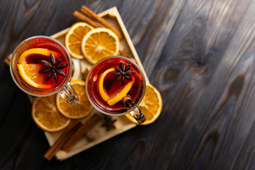 Mulled wine on tray with oranges