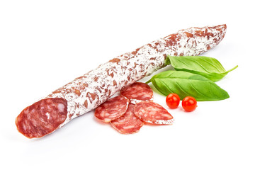 Traditional Spanish Fuet thin dried sausage with slices, Close-up, isolated on a white background.