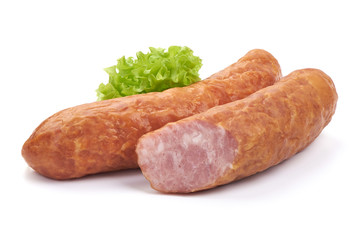 German specialty salami. Hard cured sausage with lettuce, Close-up, isolated on a white background.