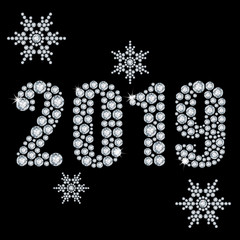 The crystals 2019 year from diamond on a black background and snowflakes