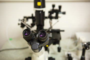 The equipment in the laboratory of the clinic of in vitro fertilization IVF. Microscope, tubes, nitrogen, other devices for chemical manipulations in the laboratory