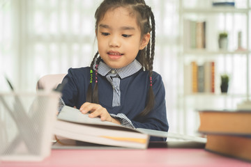 Asian young girl read a book