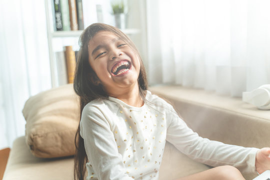  asisn kids having fun in the home