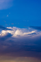 Landscape with dramatic light - beautiful golden sunset with saturated sky and clouds.