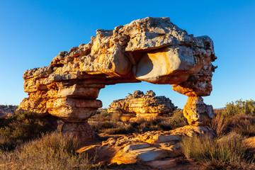 Rock arch against a clear blue sky near Kagga Kamma nature reserve in South Africa
