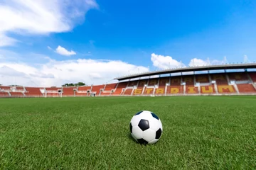 Fotobehang Voetbal football field  ball on green grass , soccer field athletics stadium and blue sky background