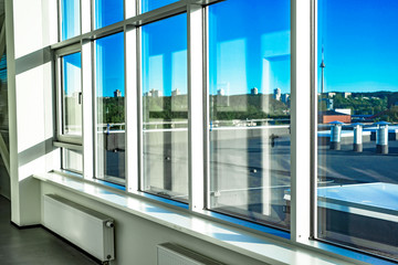 Large metal-plastic windows in the office room