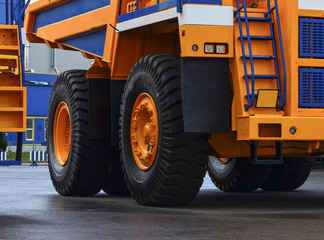 The protector of a large rubber wheel. Huge rubber tire career dump trucks, mining trucks from the tipper. Mounting