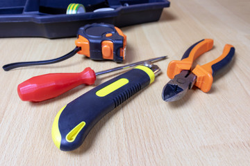 Tools laid out on a room floor. Construction and repair concept