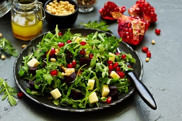 Fresh salad of arugula, beet and cheese.